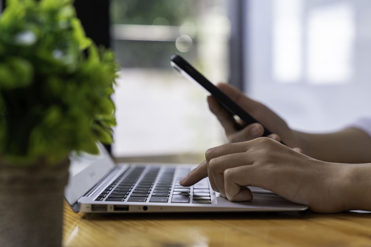 businesswoman-uses-a-mobile-phone-to-check-informa-2023-11-27-04-49-13-utc