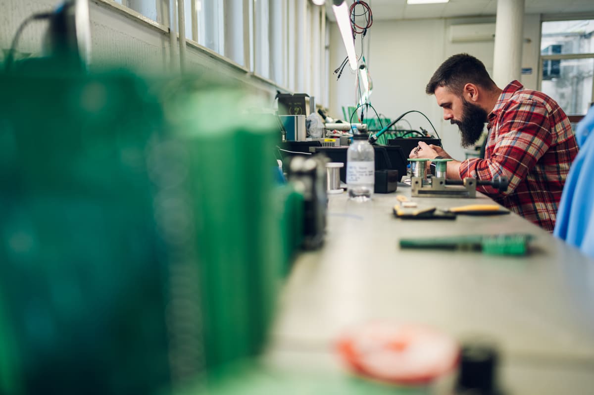 electronics-engineer-working-in-a-workshop-with-ti-2023-11-27-05-33-47-utc